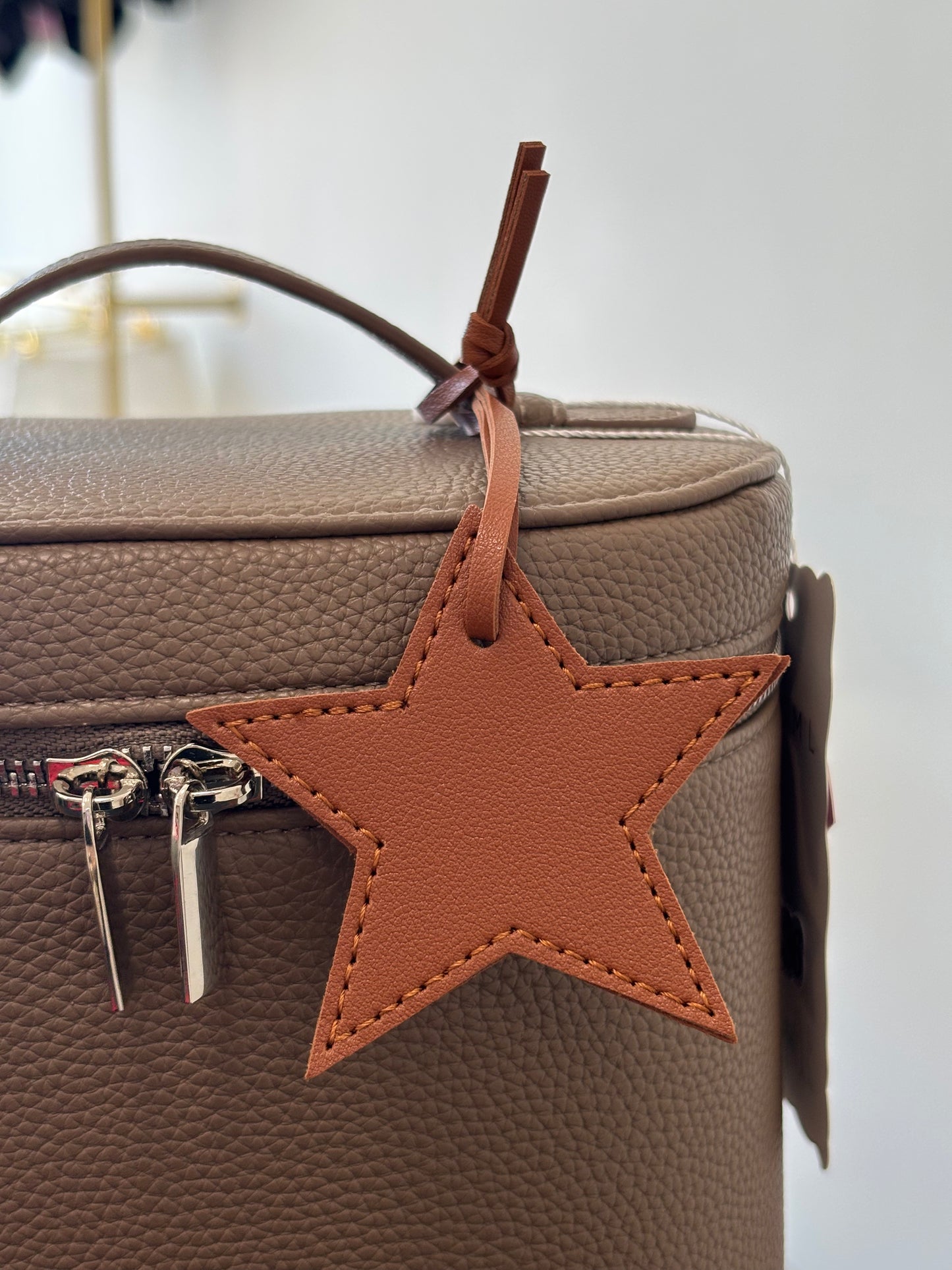 Brown star charm
